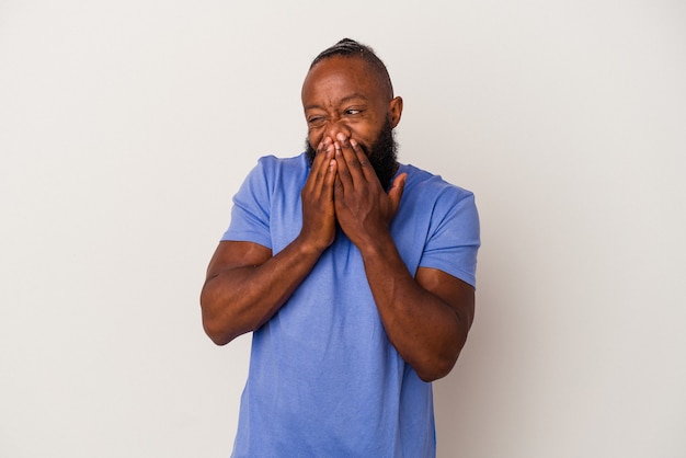 african-american-man-with-beard-isolated-pink-background-laughing-about-something-covering-mou...jpg